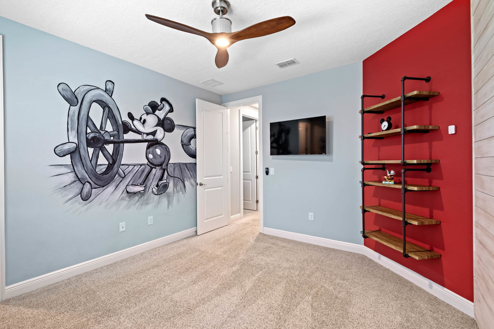 bedroom with steamboat willie painting